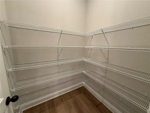 a view of a room with racks on the wall