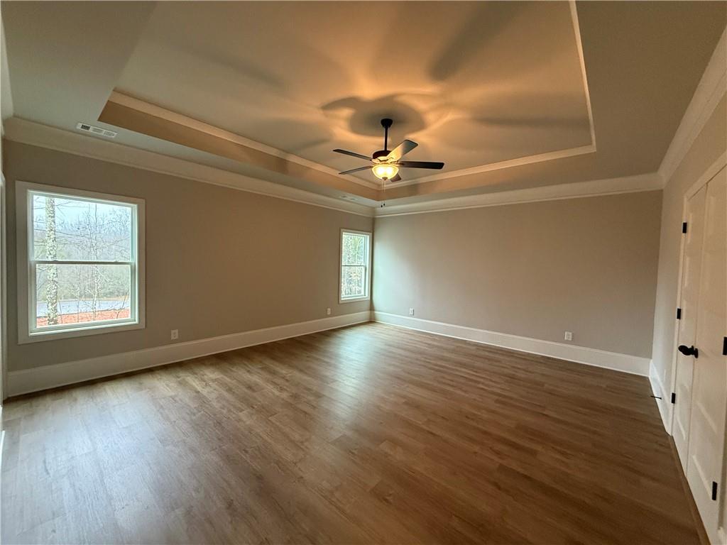 3838 Cheyenne Lane Jefferson, GA 30549 - Photo 21 of 29 a view of an empty room with window and wooden floor