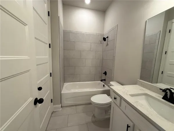 a bathroom with a sink a toilet and a bathtub