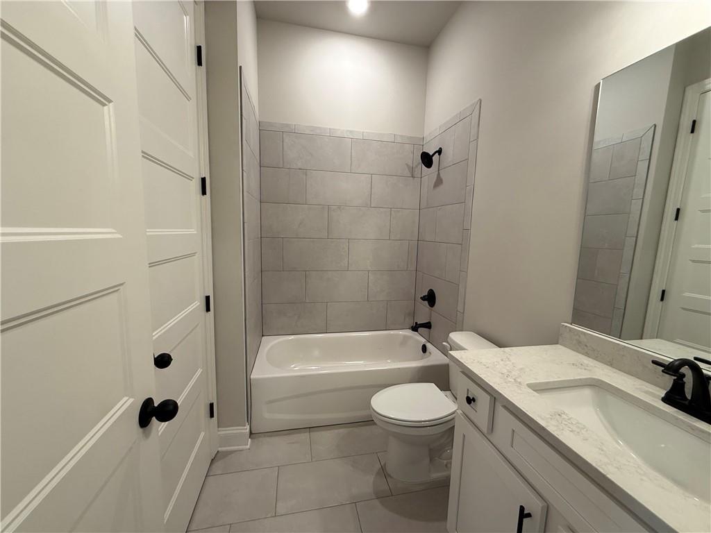 3838 Cheyenne Lane Jefferson, GA 30549 - Photo 5 of 29 a bathroom with a sink a toilet and a bathtub