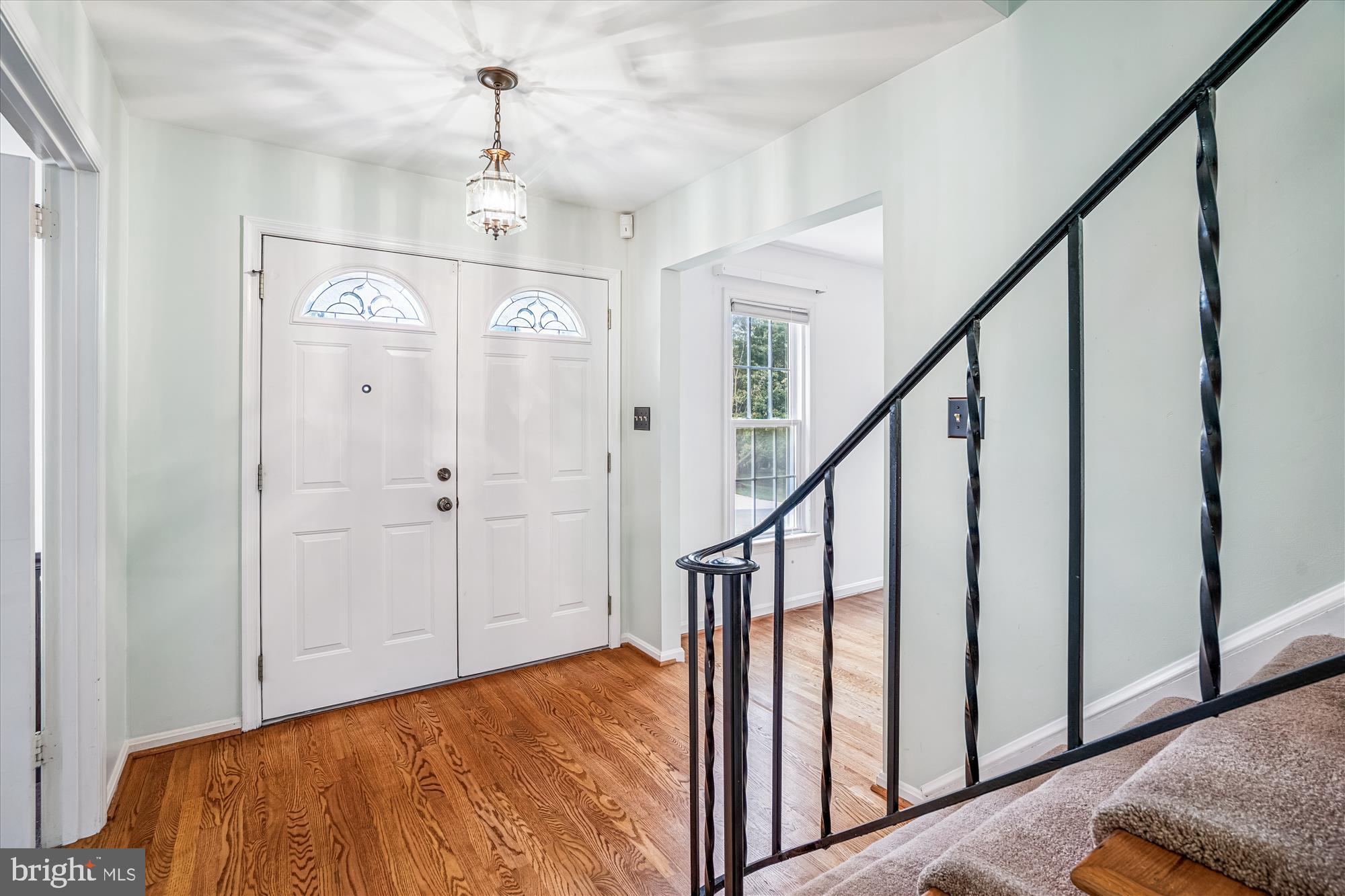 1913 Hopefield Road Silver Spring, MD 20905 - Photo 5 of 67 a view of a hallway with wooden floor and staircase