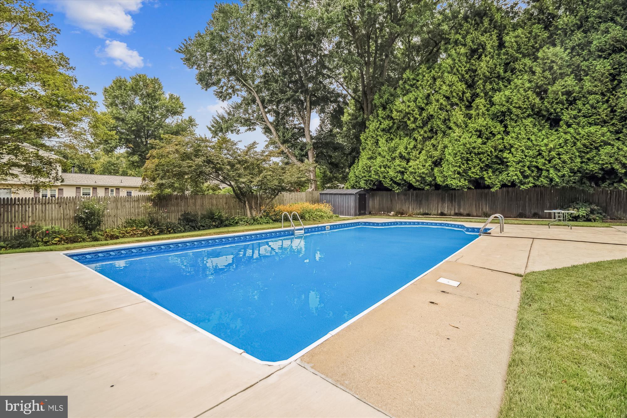 1913 Hopefield Road Silver Spring, MD 20905 - Photo 62 of 67 a view of a swimming pool with an outdoor space and seating area