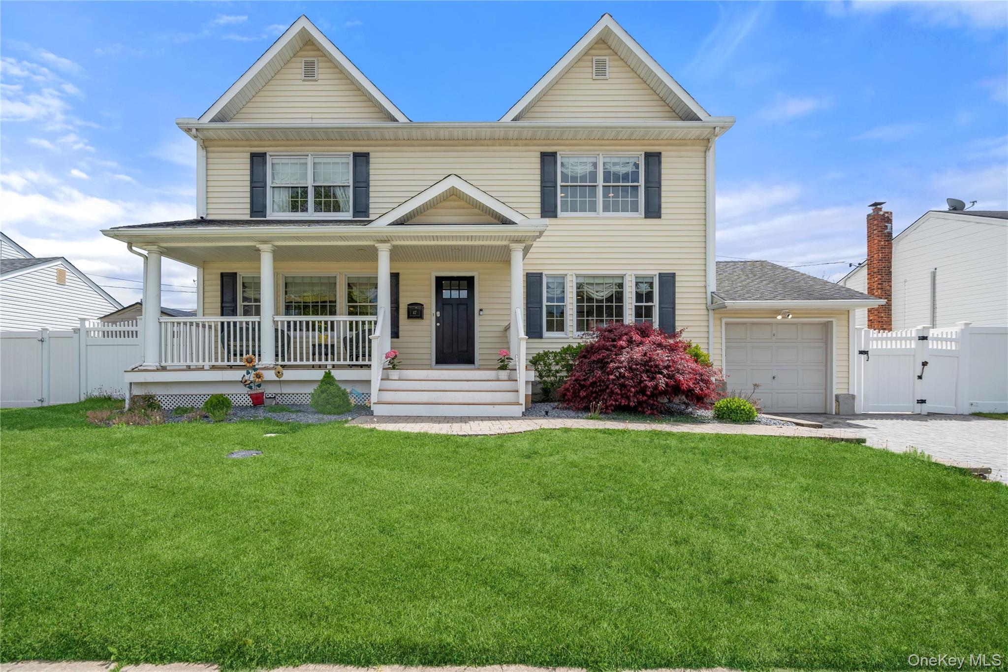 47 Syosset Circle Syosset, NY 11791 - Photo 1 of 30 a front view of a house with a garden