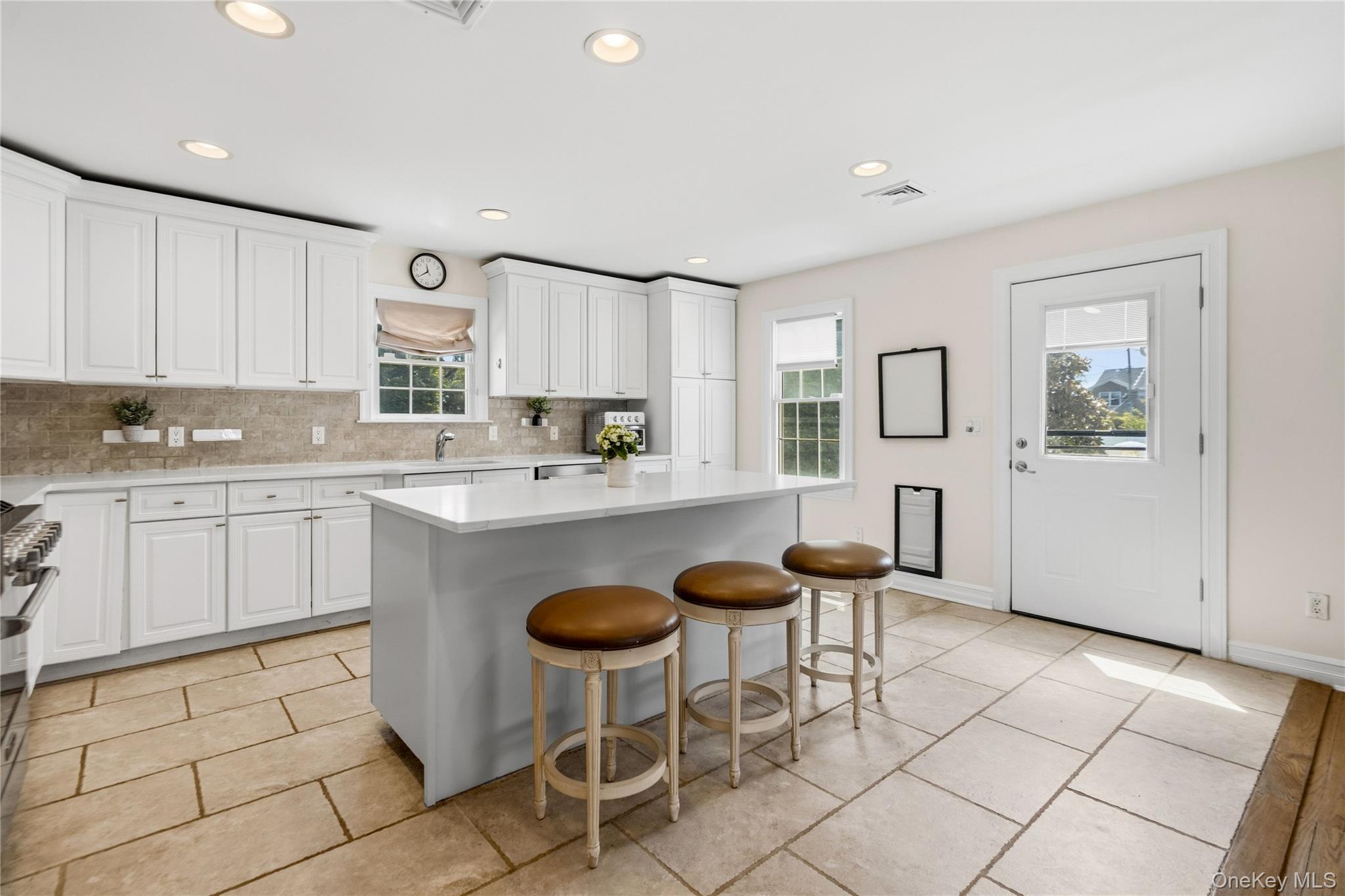 47 Syosset Circle Syosset, NY 11791 - Photo 11 of 30 a kitchen with granite countertop a sink cabinets and window