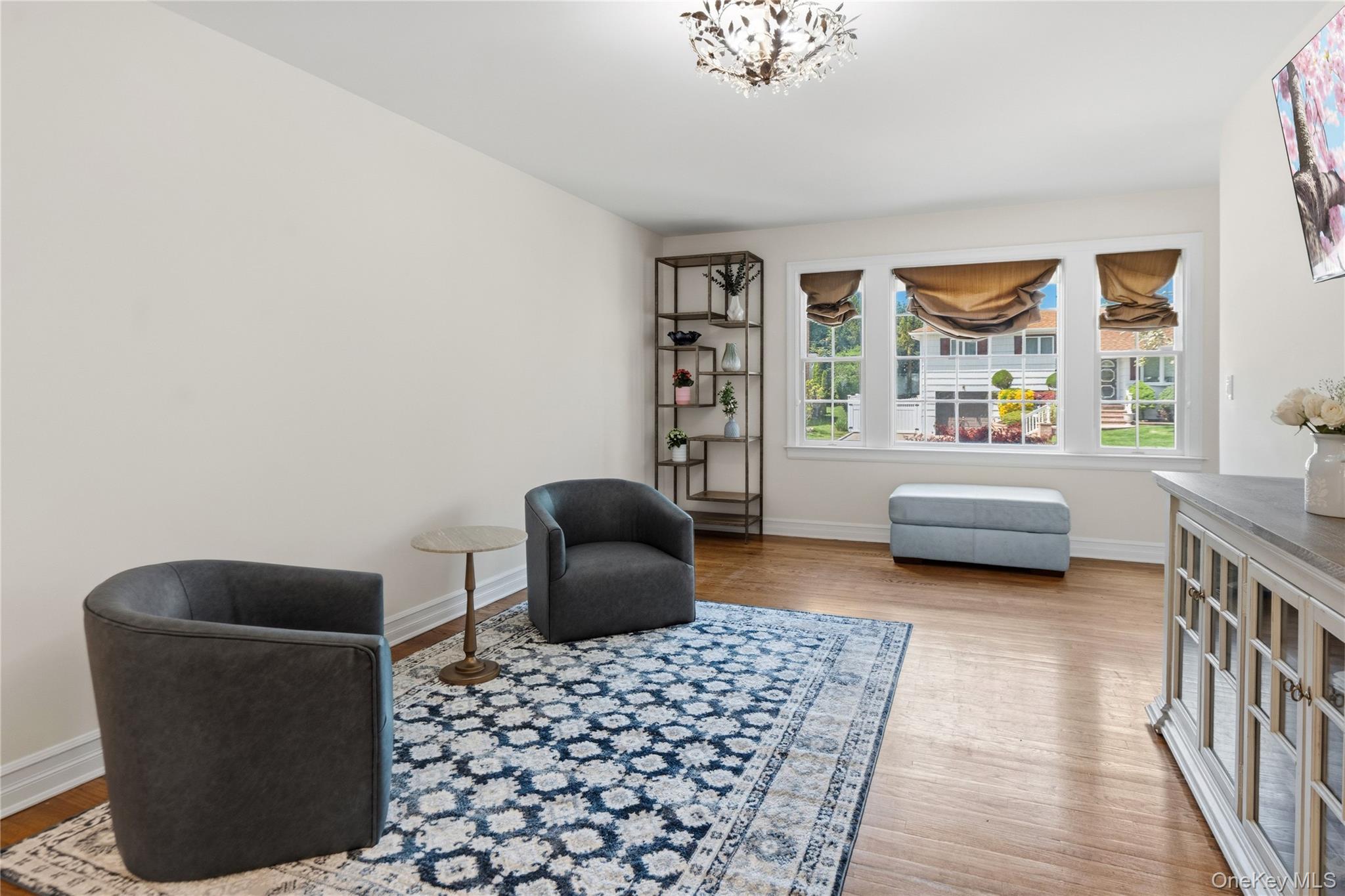 47 Syosset Circle Syosset, NY 11791 - Photo 17 of 30 a living room with furniture and a window