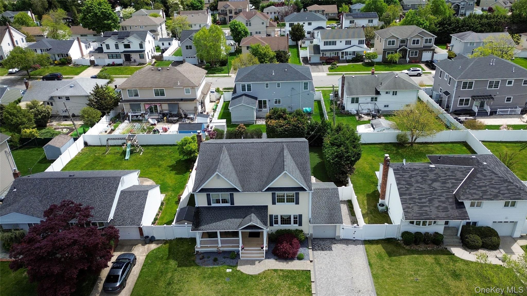 47 Syosset Circle Syosset, NY 11791 - Photo 29 of 30 an aerial view of multiple houses with a yard