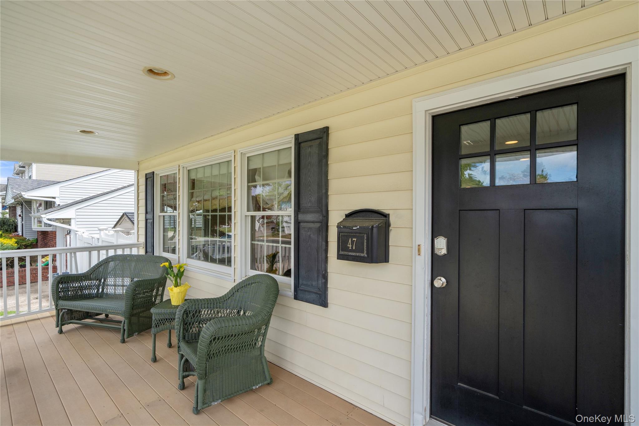 47 Syosset Circle Syosset, NY 11791 - Photo 4 of 30 a building outdoor space with patio furniture and potted plants