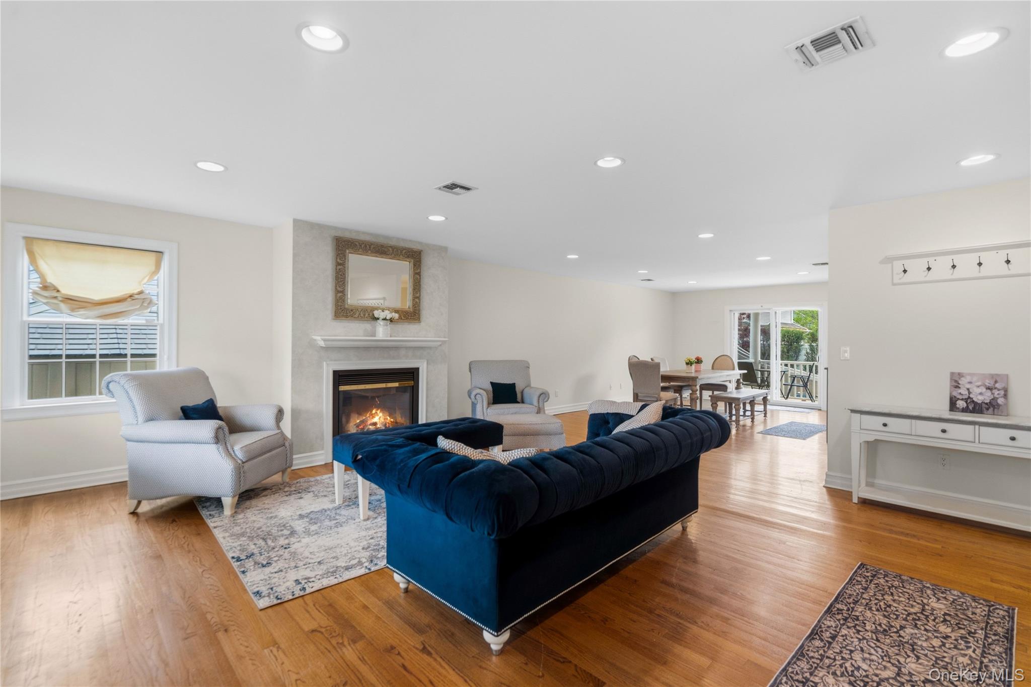 47 Syosset Circle Syosset, NY 11791 - Photo 5 of 30 a living room with furniture and a fireplace