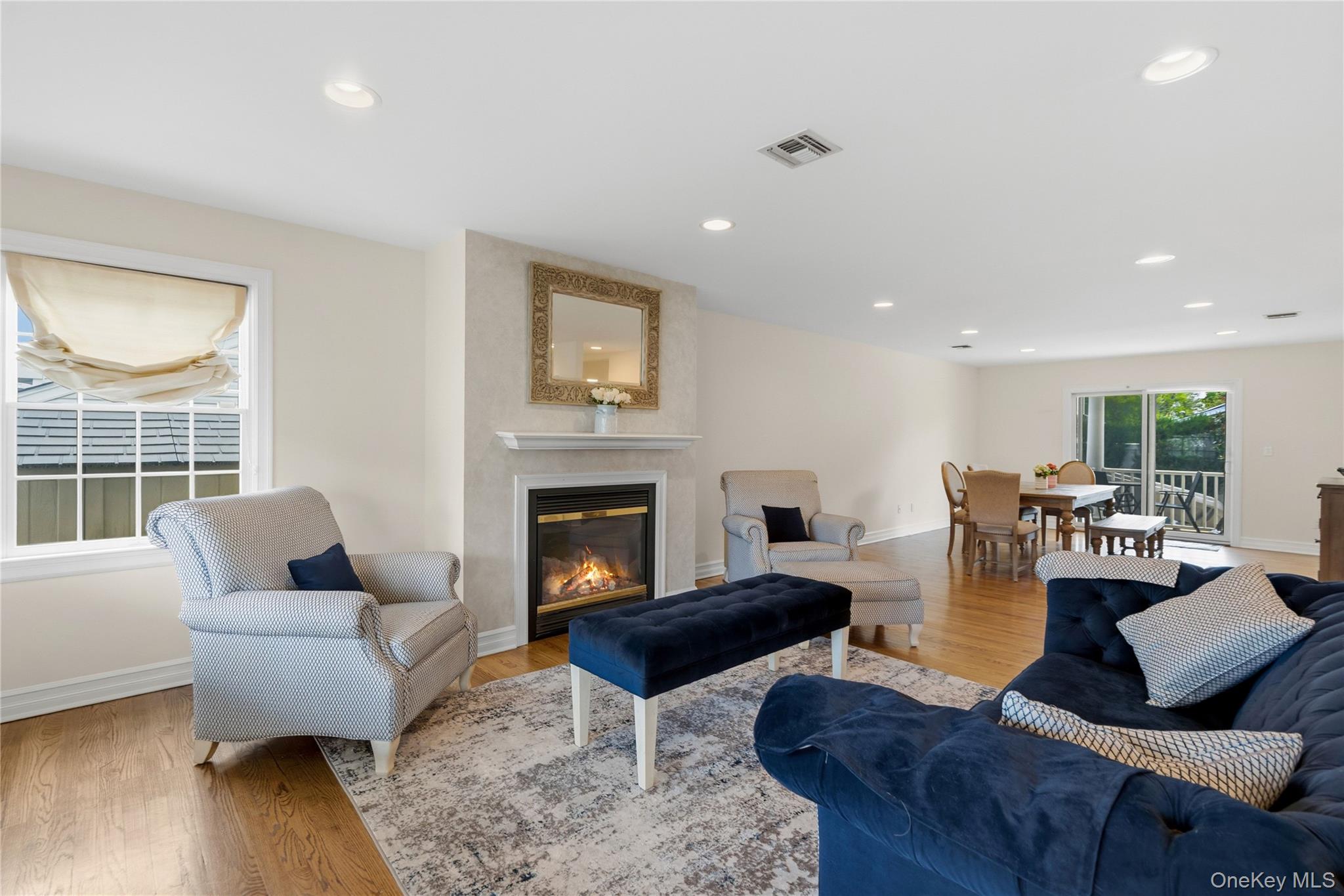 47 Syosset Circle Syosset, NY 11791 - Photo 6 of 30 a living room with furniture and a fireplace