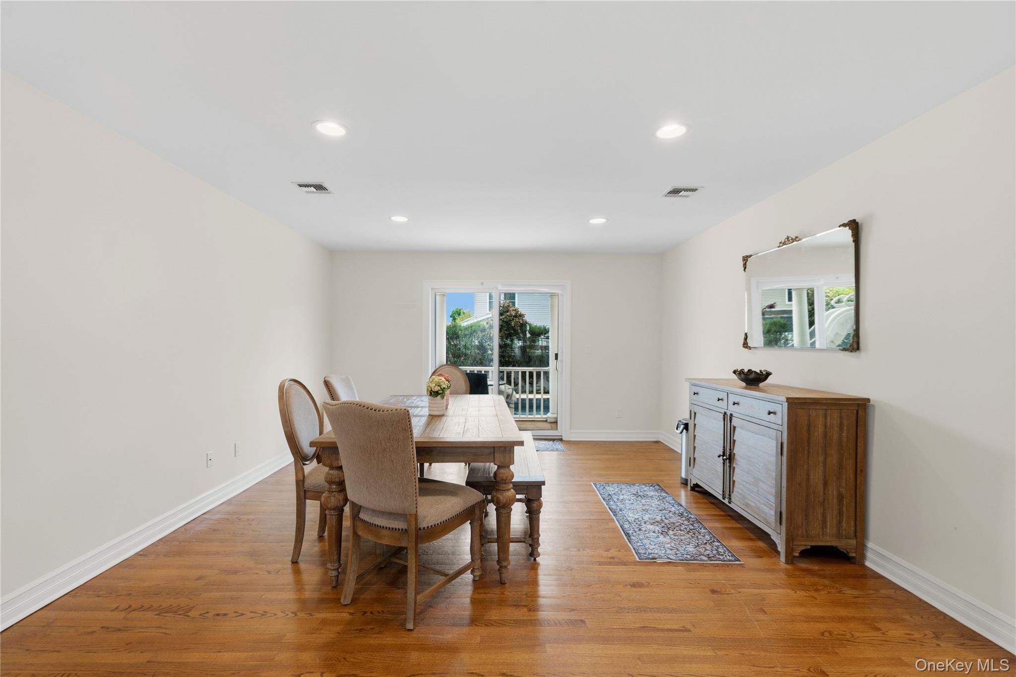 47 Syosset Circle Syosset, NY 11791 - Photo 8 of 30 a dining room with furniture and wooden floor