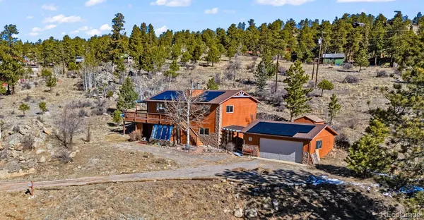an aerial view of a house with outdoor space