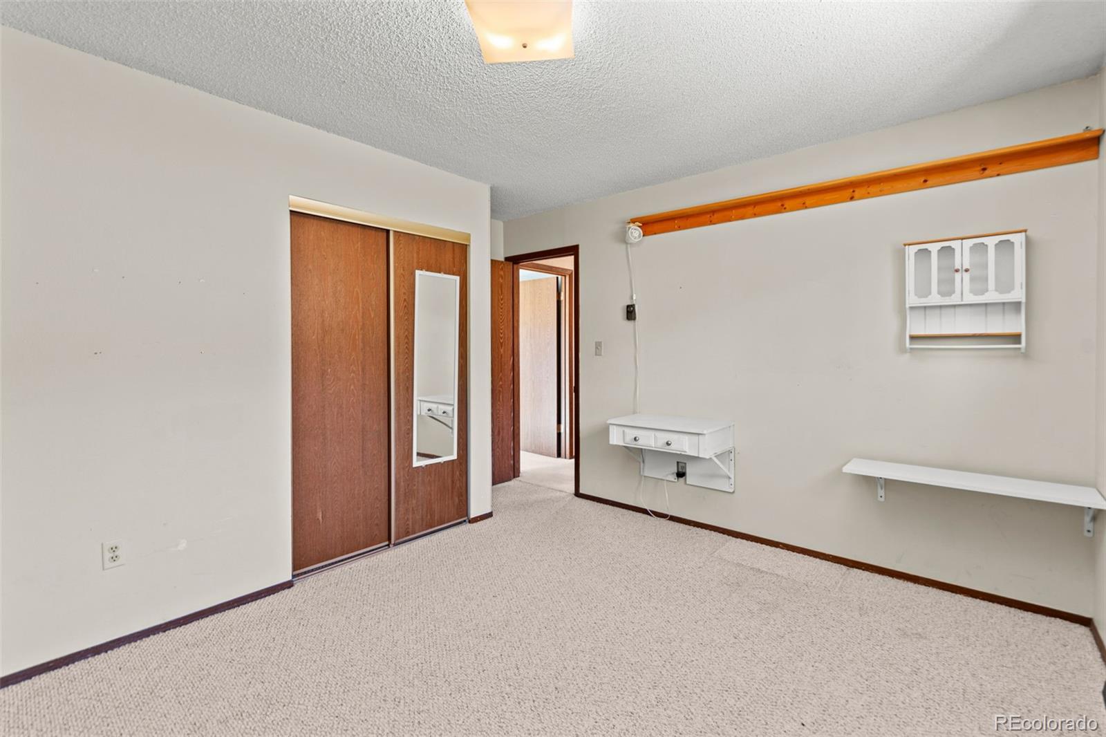 237 Homestead Road Bailey, CO 80421 - Photo 22 of 43 wooden floor in an empty room