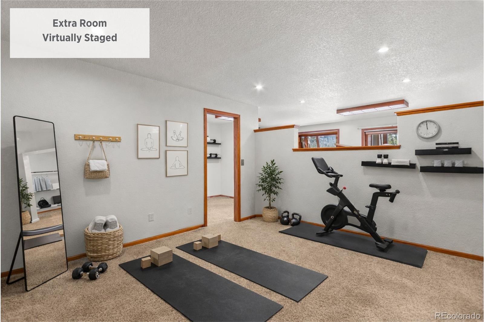 237 Homestead Road Bailey, CO 80421 - Photo 27 of 43 a room with gym equipment and a table
