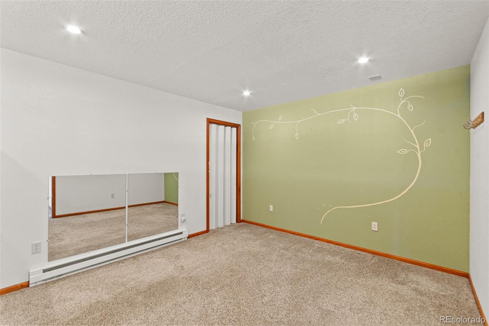 237 Homestead Road Bailey, CO 80421 - Photo 29 of 43 an empty room with sliding glass door