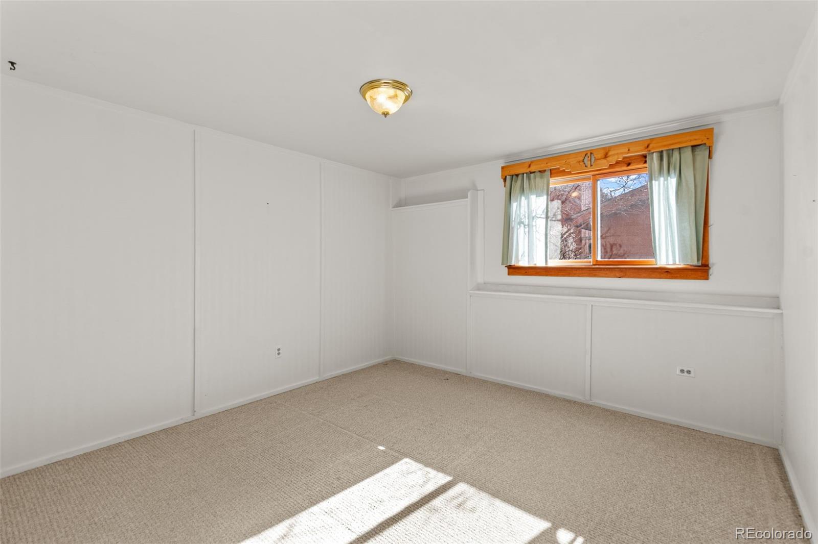 237 Homestead Road Bailey, CO 80421 - Photo 30 of 43 an empty room with windows