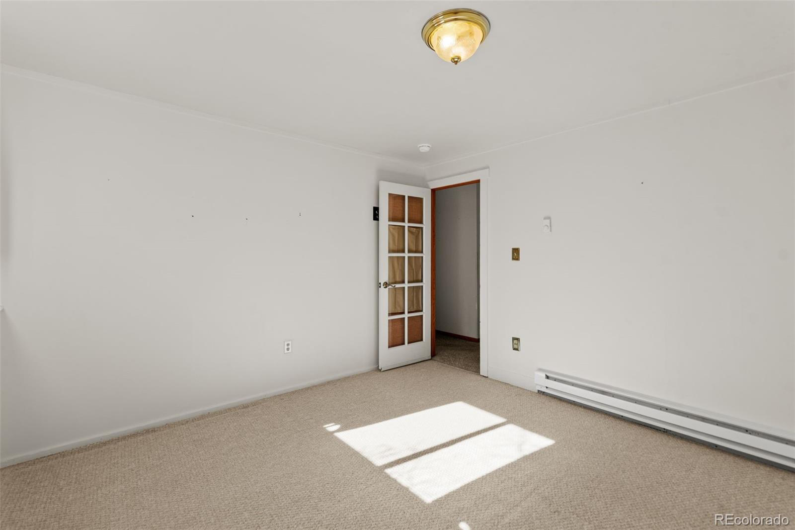 237 Homestead Road Bailey, CO 80421 - Photo 31 of 43 an empty room with windows