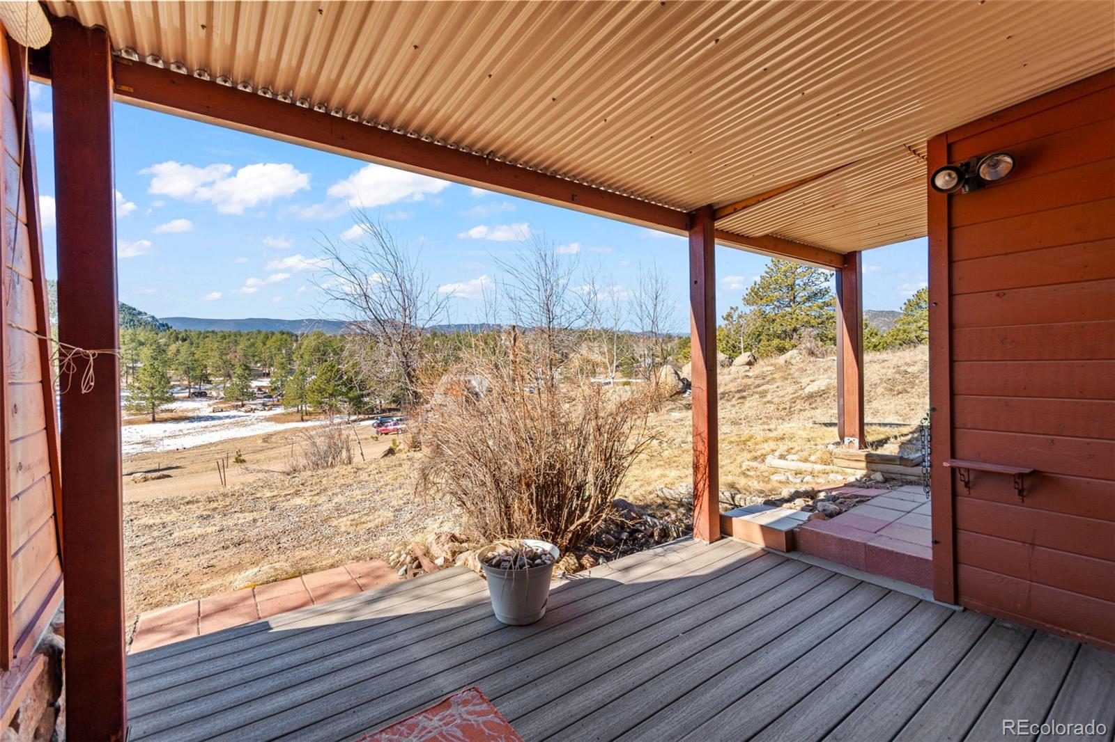 237 Homestead Road Bailey, CO 80421 - Photo 38 of 43 a view of a room with wooden floor and outdoor space