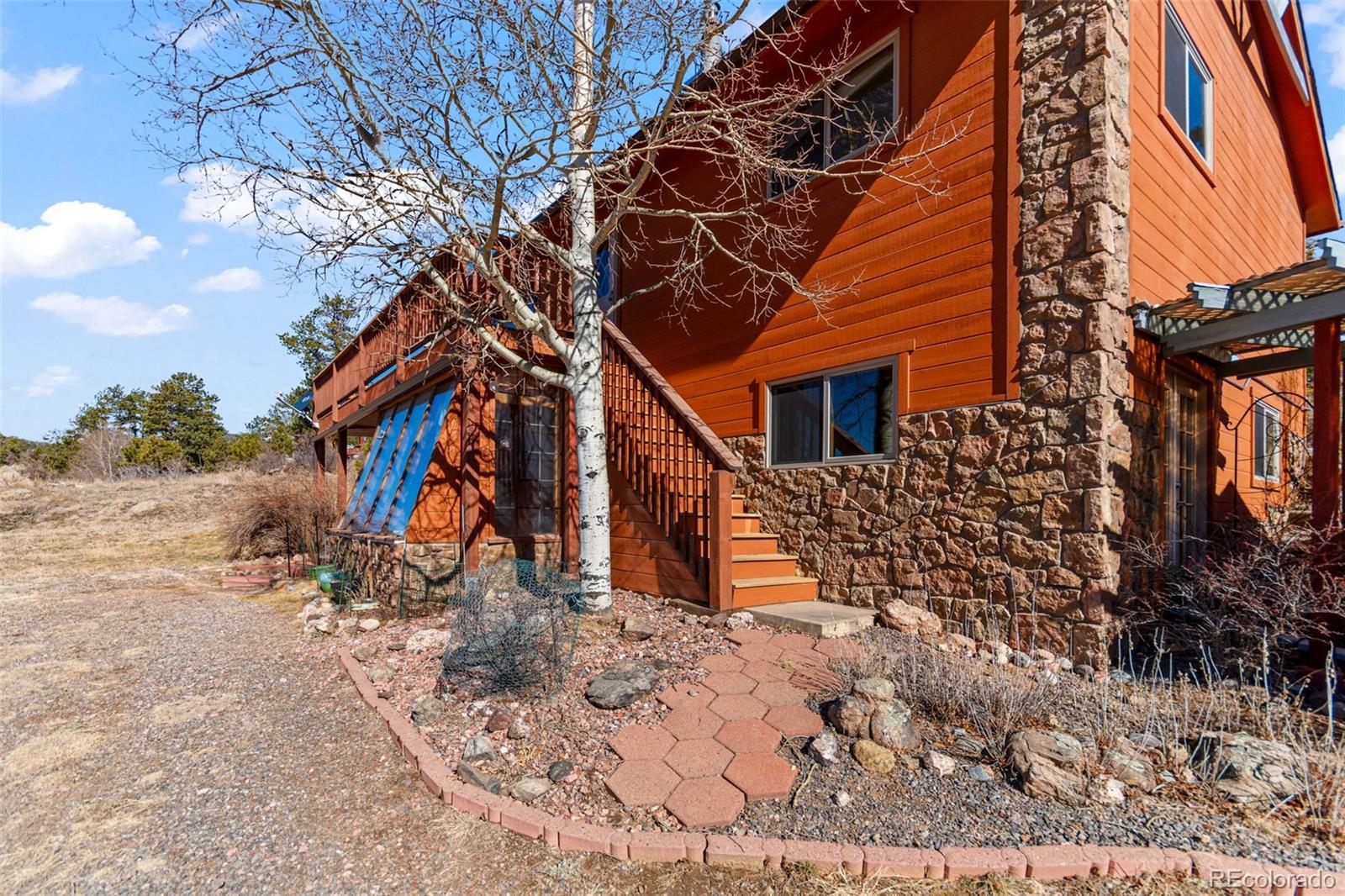 237 Homestead Road Bailey, CO 80421 - Photo 4 of 43 a view of a house with a yard