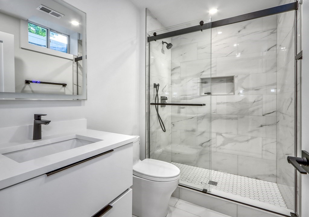 55 Athelstane Road, Unit 55 Newton, MA 02459 - Photo 29 of 38 a bathroom with a sink a toilet and shower