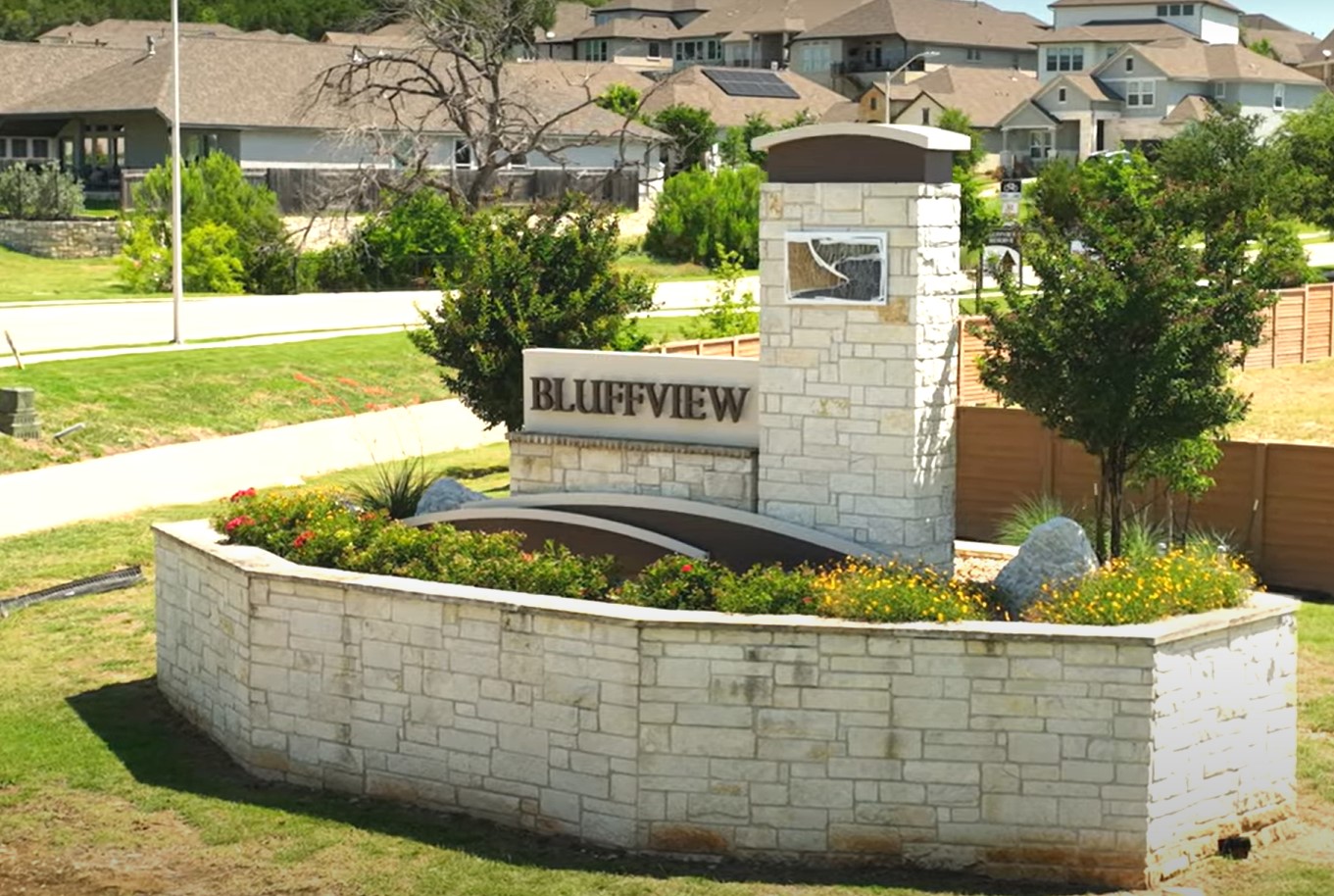 3105 Delaware Street Leander, TX 78641 - Photo 3 of 6 Stone-clad signage and vibrant plantings welcome all to this distinguished residential community.