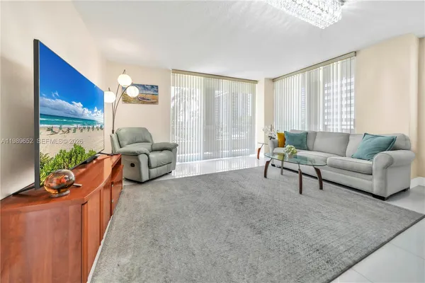 a living room with furniture and a large window