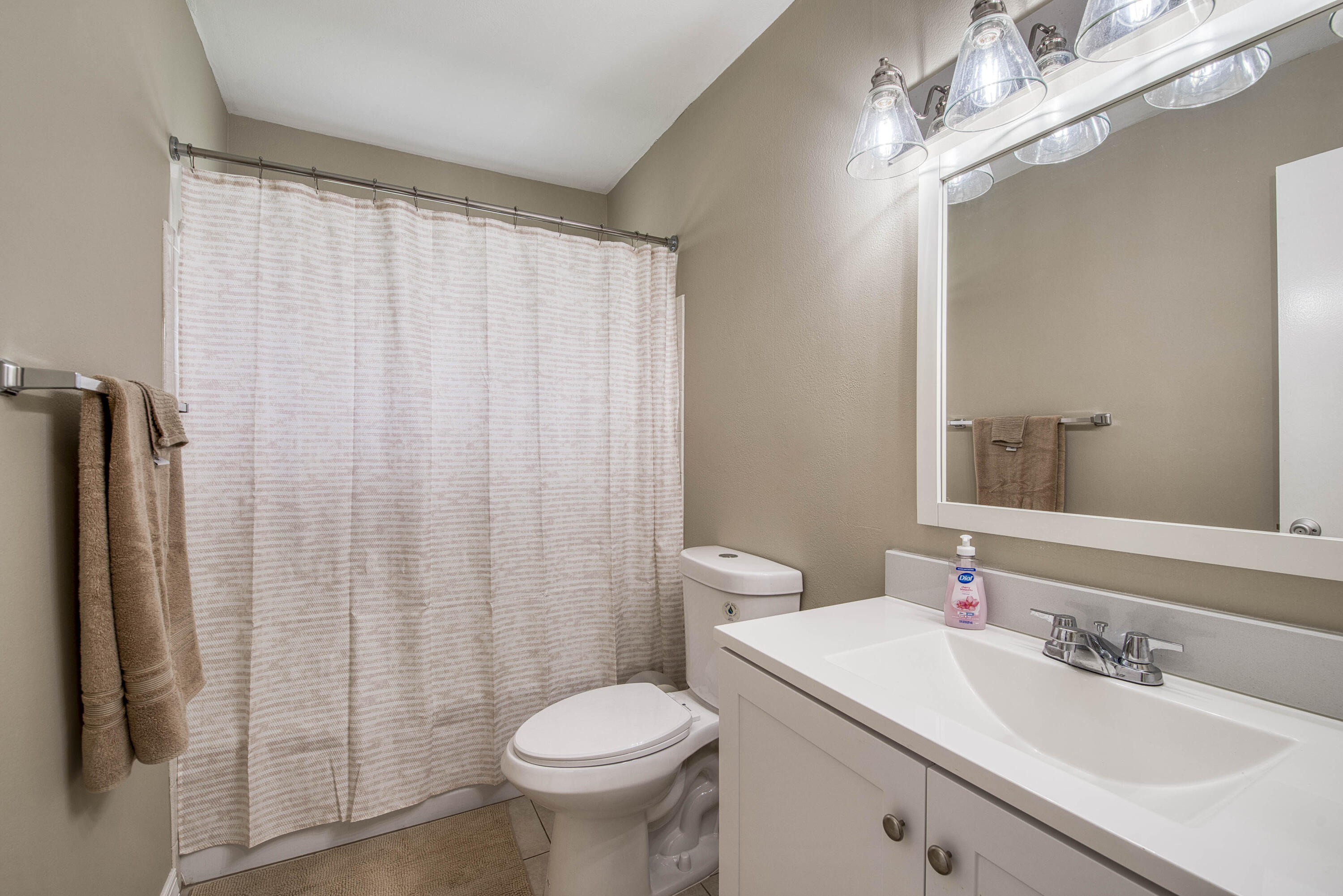 2929 Southeast Ocean Boulevard, Unit 1146 Stuart, FL 34996 - Photo 15 of 19 a bathroom with a sink toilet and shower