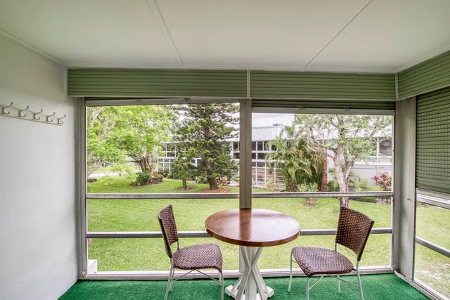 a view of a chairs and table in a room