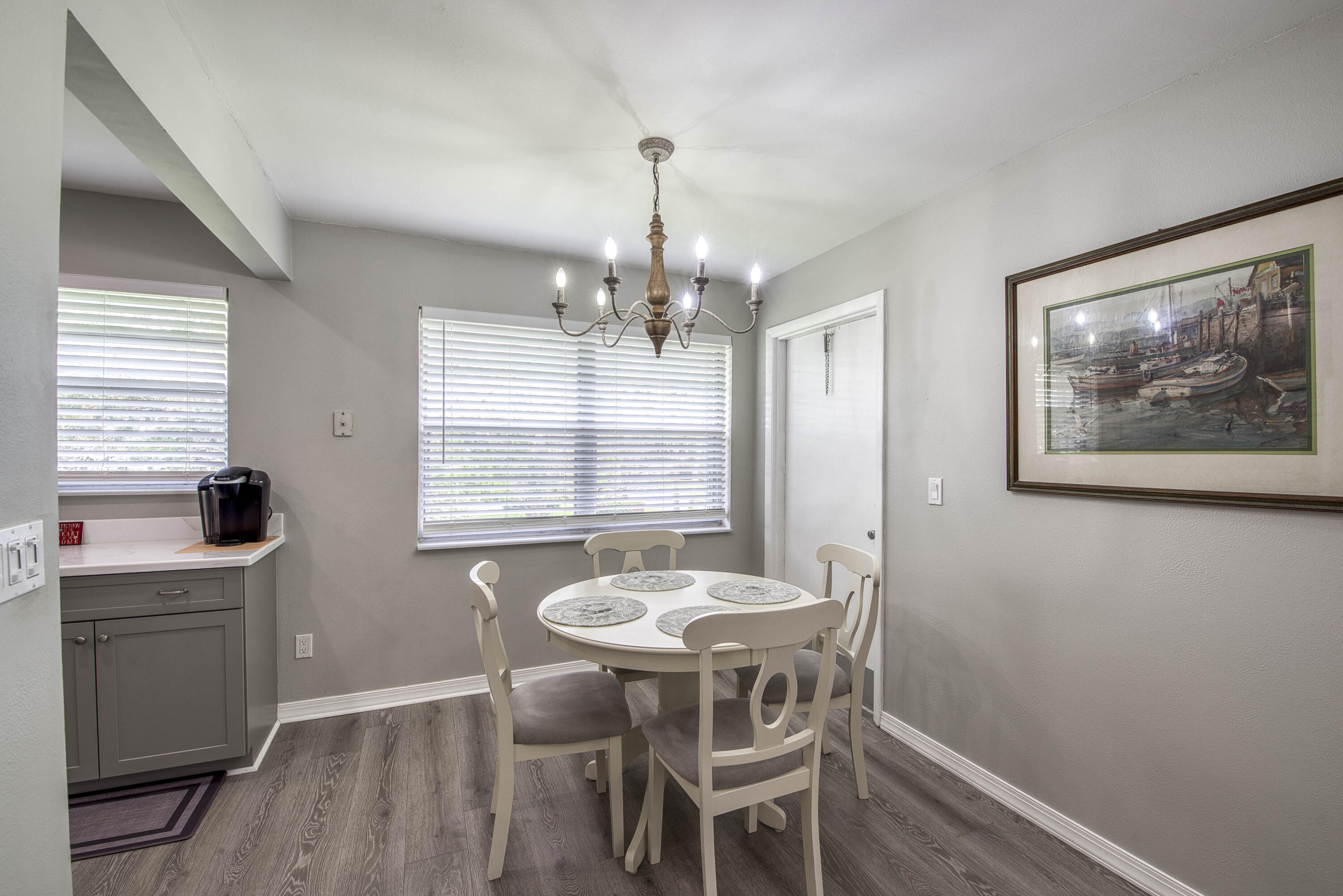 2929 Southeast Ocean Boulevard, Unit 1146 Stuart, FL 34996 - Photo 5 of 19 a view of a dining room with furniture window and wooden floor