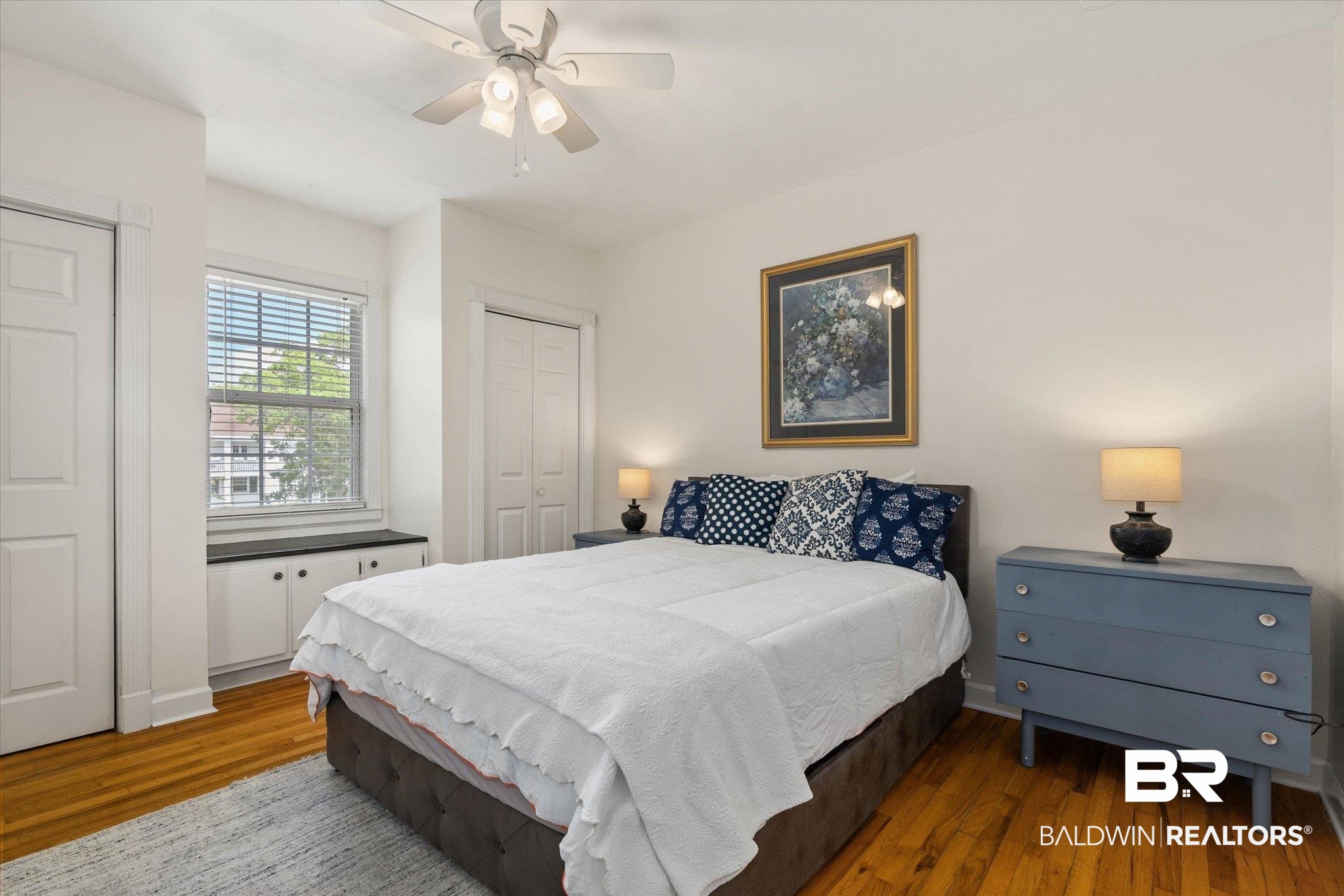 214 Upham Street, Unit 18C Mobile, AL 36607 - Photo 14 of 35 Bedroom featuring wood finished floors and a ceiling fan