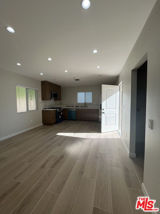 1842 Deodora Street Simi Valley, CA 93065 - Photo 6 of 9 a view of empty room with wooden floor and window