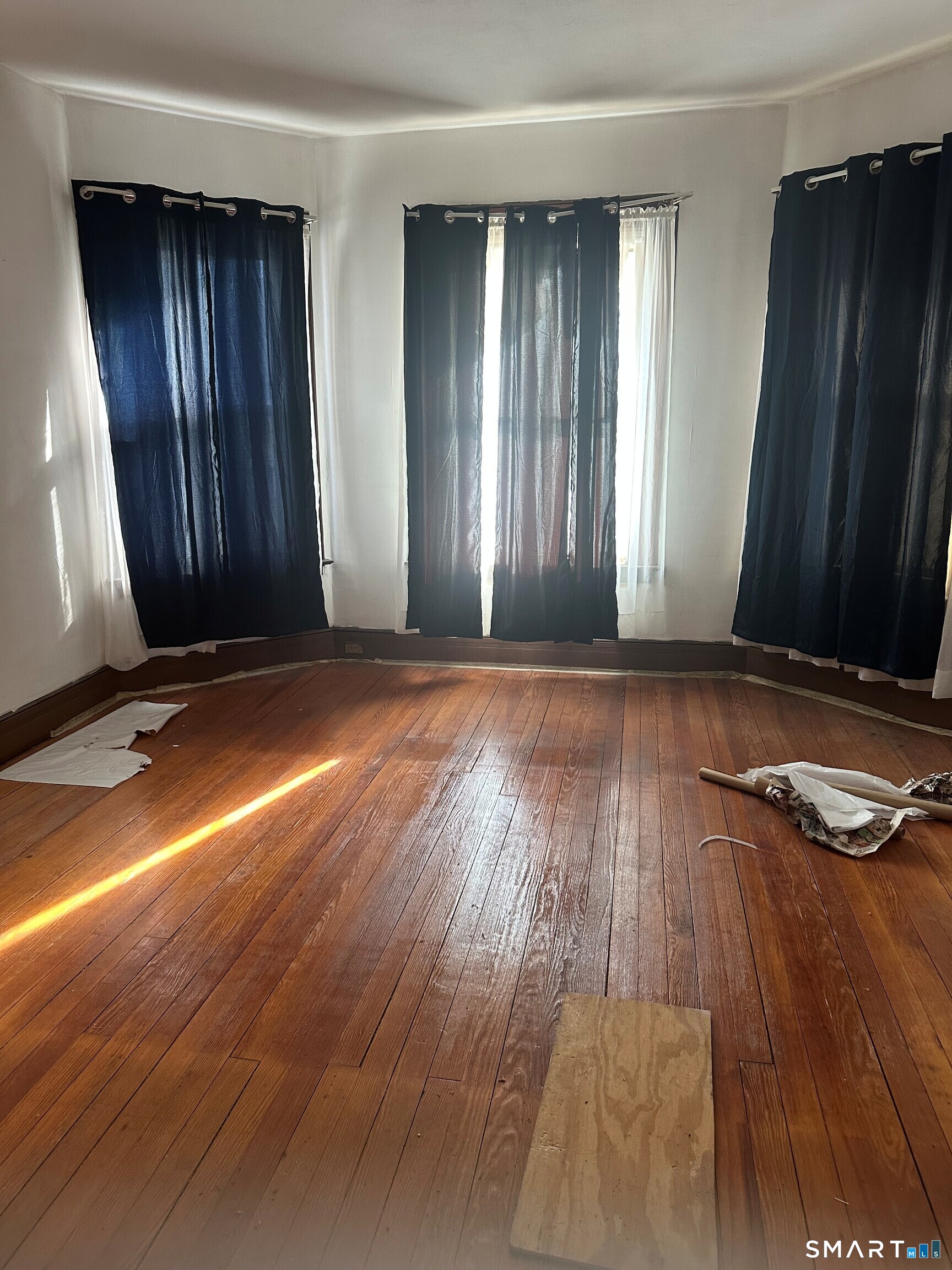 35 Tilton Street New Haven, CT 06511 - Photo 15 of 36 an empty room with wooden floor and windows