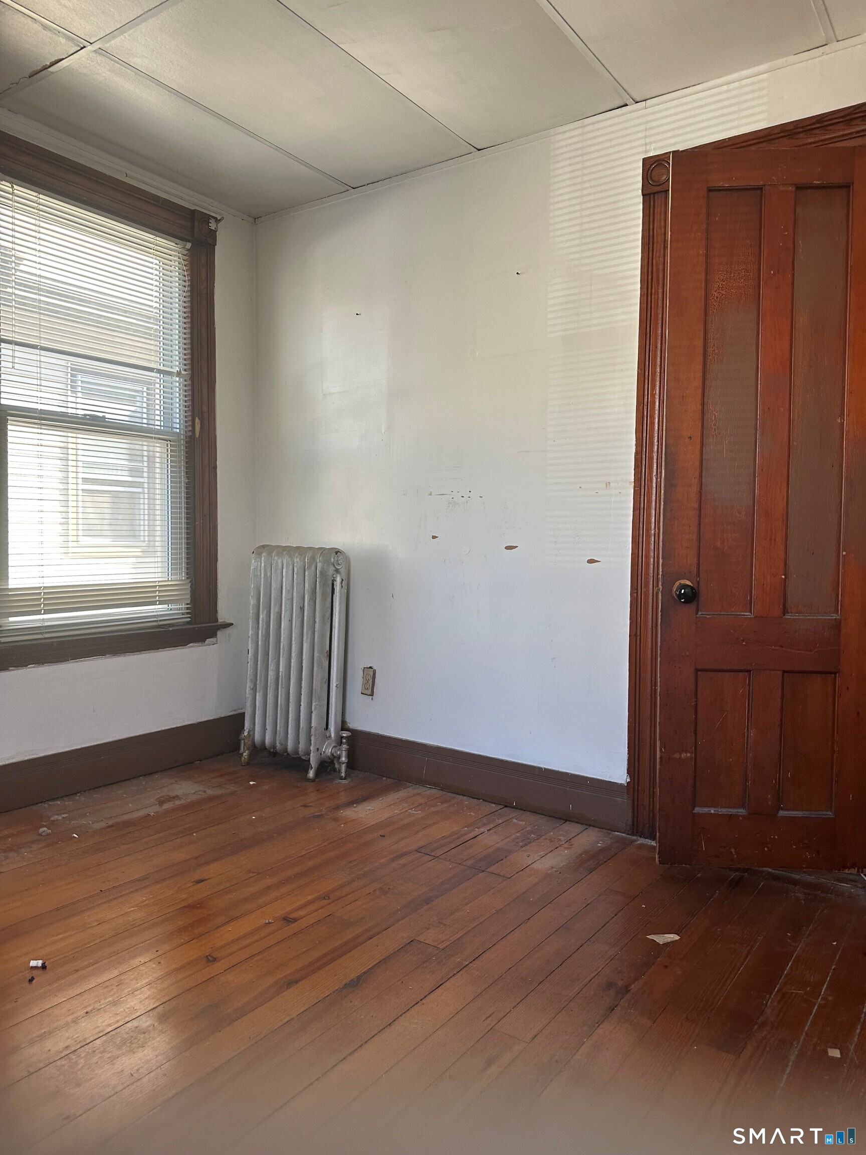 35 Tilton Street New Haven, CT 06511 - Photo 20 of 36 an empty room with wooden floor and windows