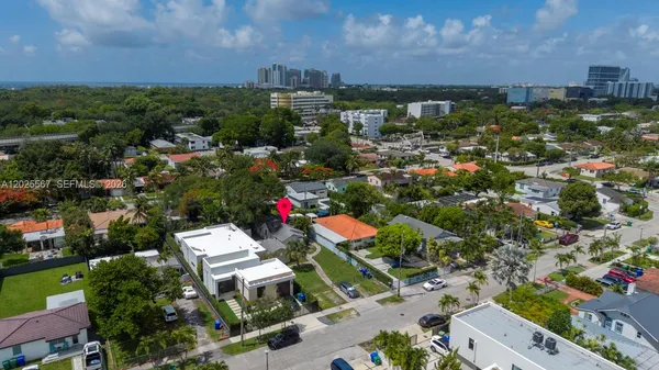 an aerial view of residential houses with outdoor space