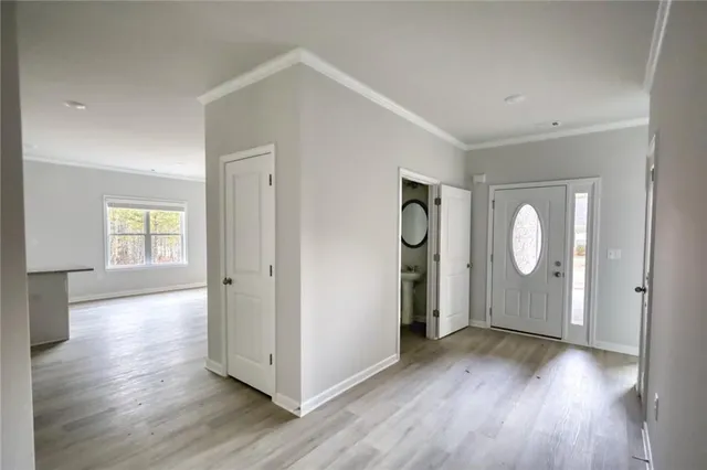 a view of a room with wooden floor window and closet