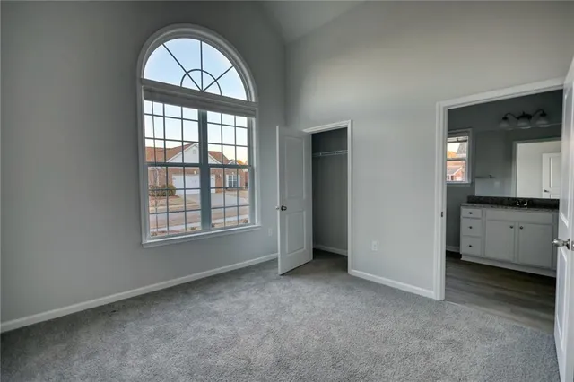 an empty room with a space and window