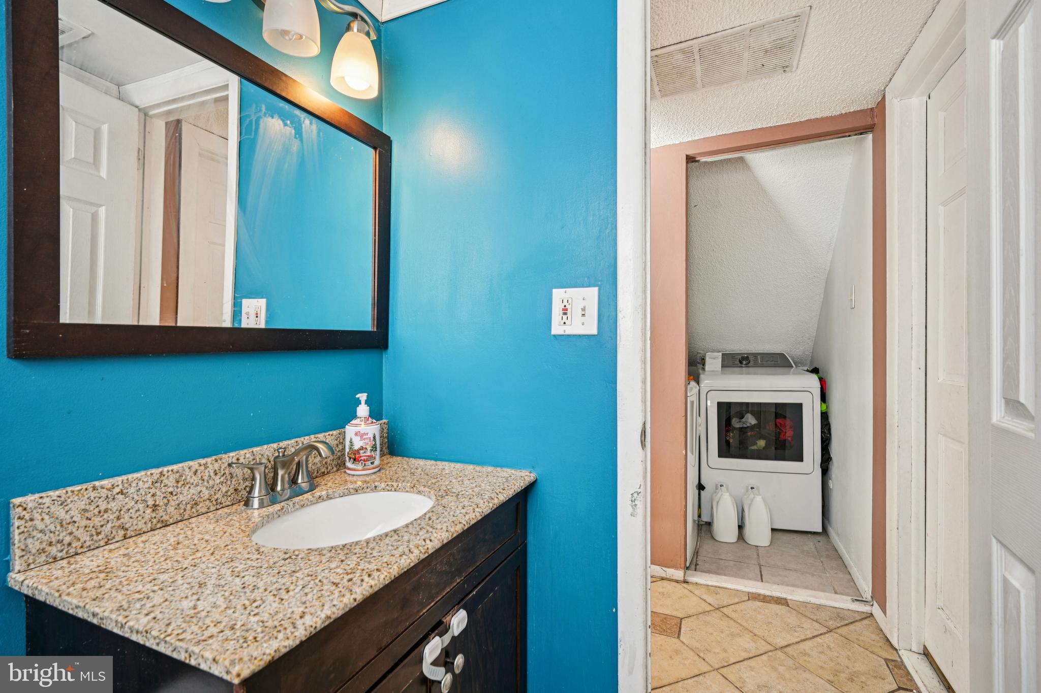 135 Windward Drive Barnegat, NJ 08005 - Photo 15 of 55 a bathroom with a sink and a mirror