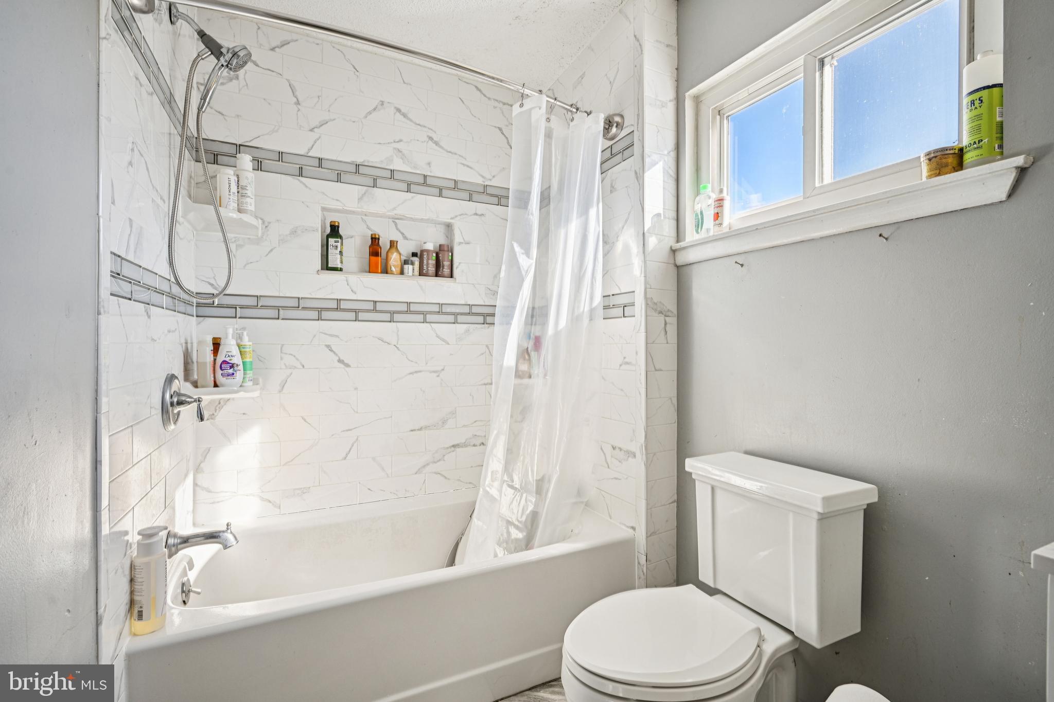 135 Windward Drive Barnegat, NJ 08005 - Photo 17 of 55 a bathroom with a toilet and a shower