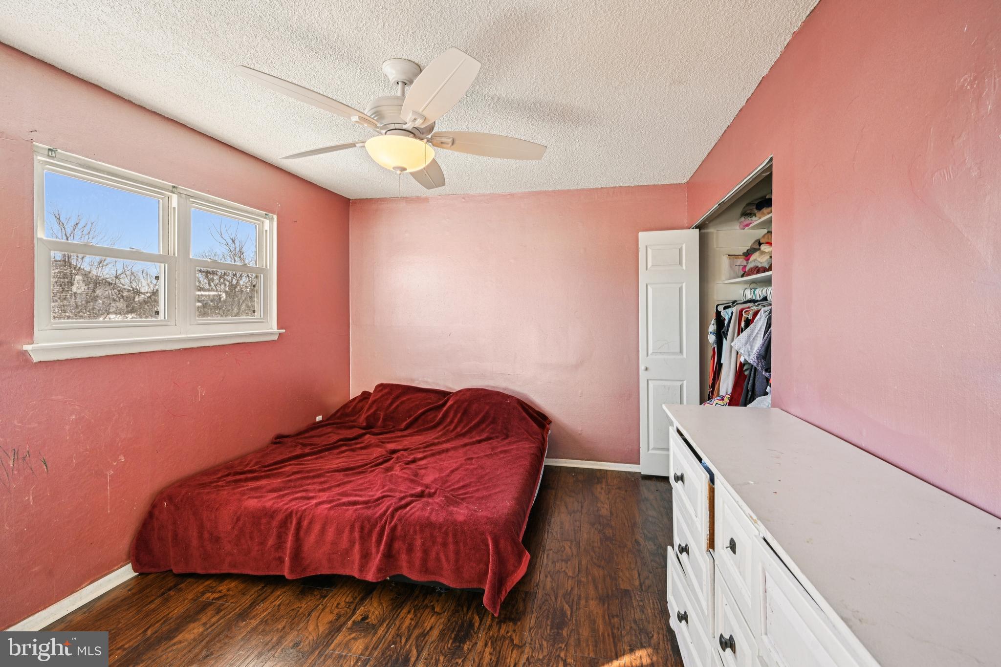135 Windward Drive Barnegat, NJ 08005 - Photo 19 of 55 a bedroom with a bed and a chandelier