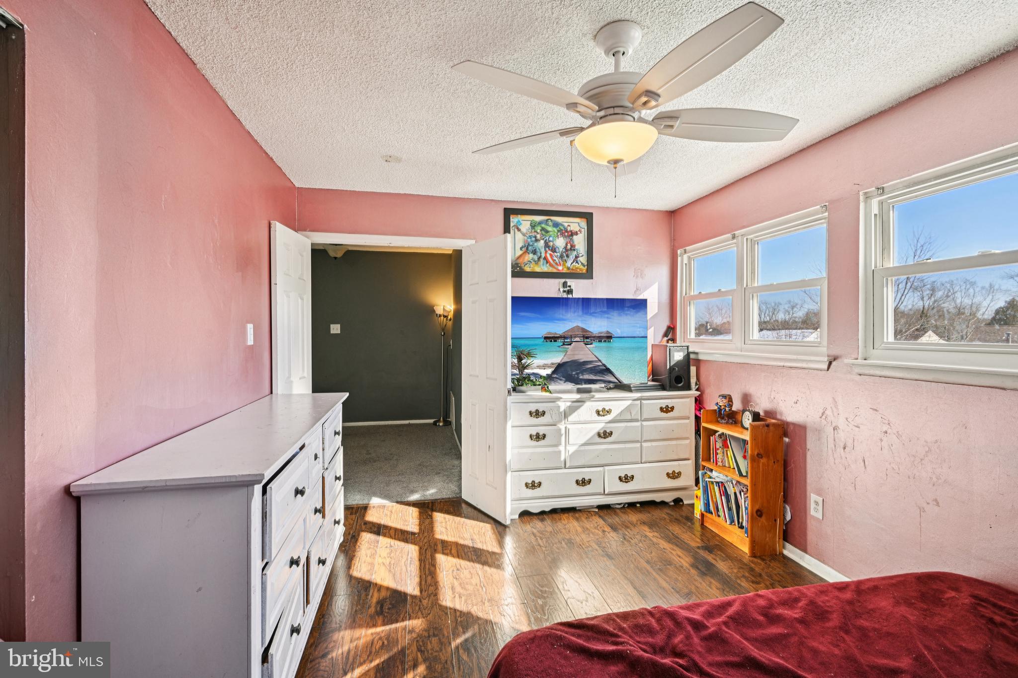 135 Windward Drive Barnegat, NJ 08005 - Photo 20 of 55 a bedroom with furniture and a chandelier