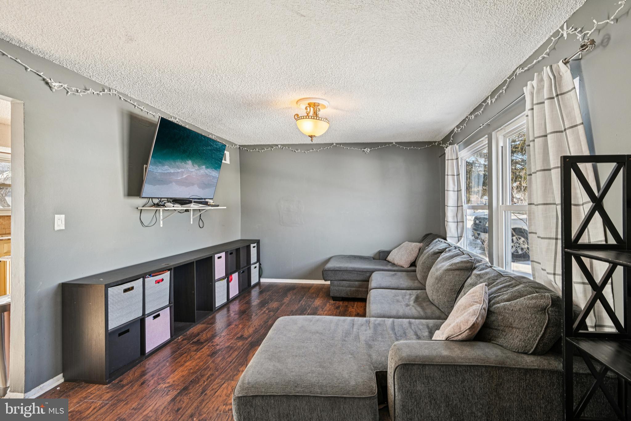 135 Windward Drive Barnegat, NJ 08005 - Photo 7 of 55 a living room with furniture and a flat screen tv