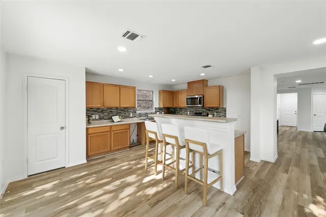 a bathroom with a sink a toilet and tub