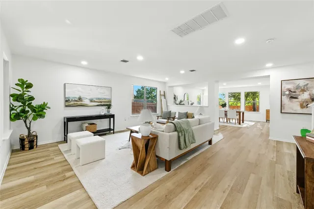 a view of a workspace room with furniture window and wooden floor