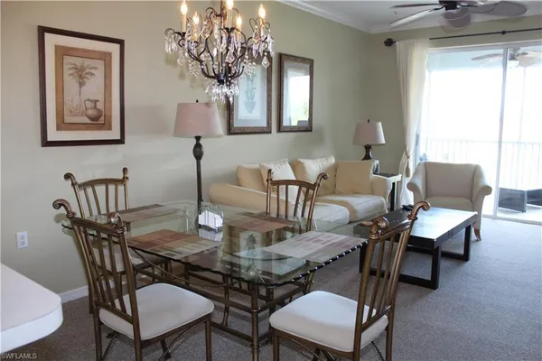 a view of a dining room with furniture window and outside view