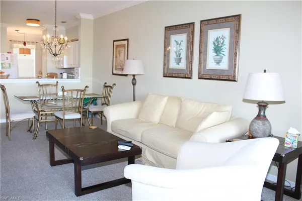 a living room with furniture and a table