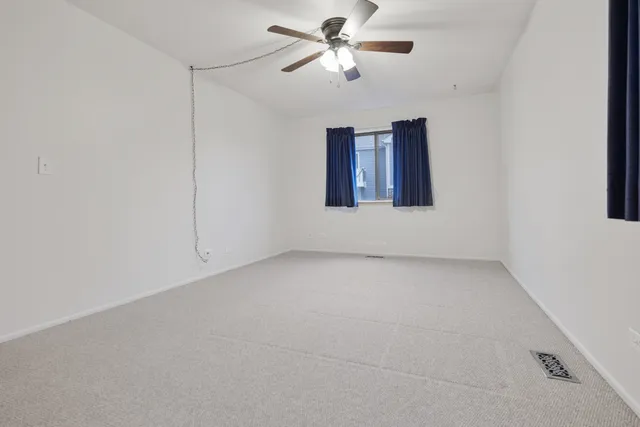 a view of a big room with carpet