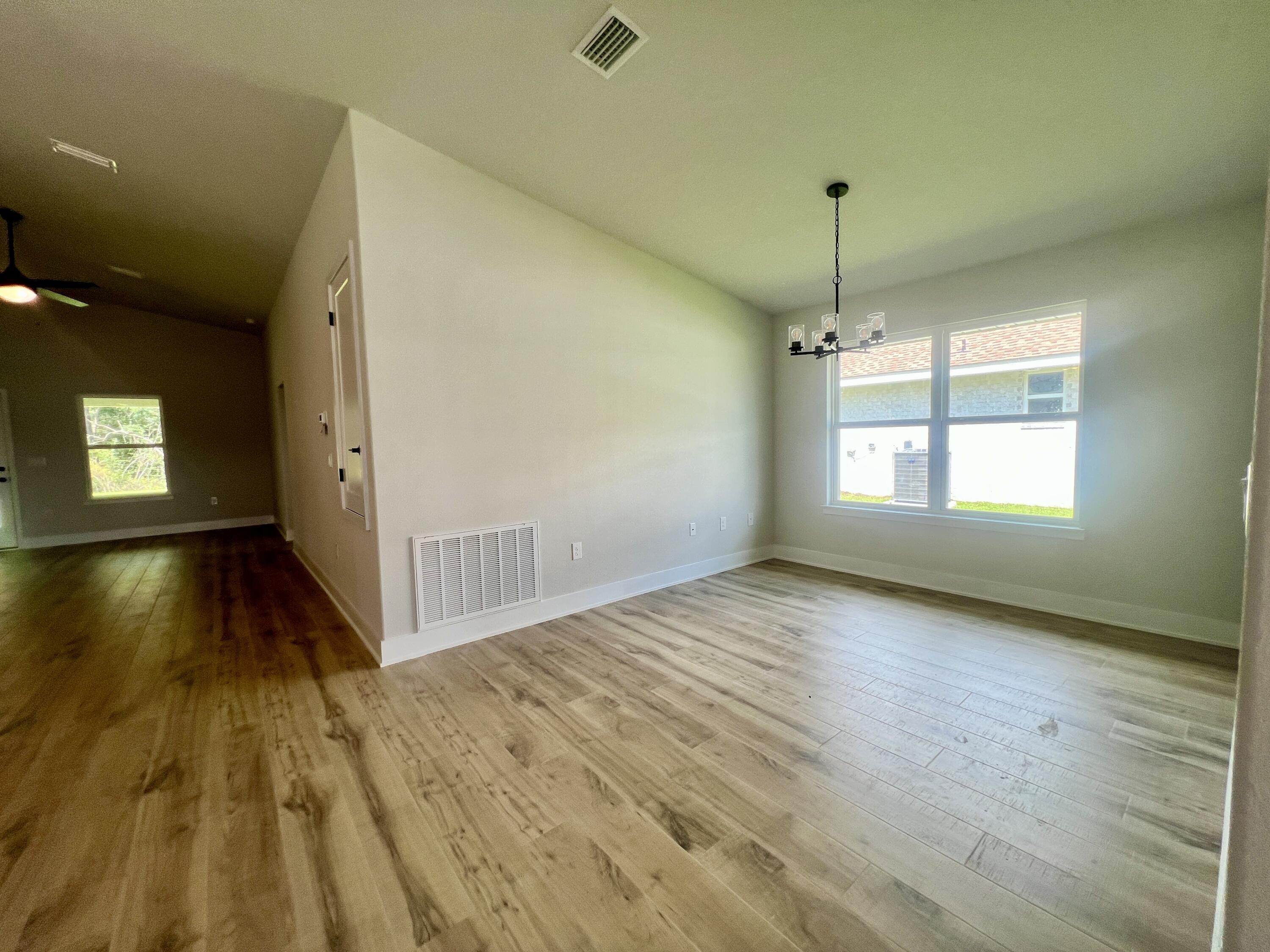 5283 Hidden Pines Circle Milton, FL 32583 - Photo 14 of 16 a view of an empty room and window