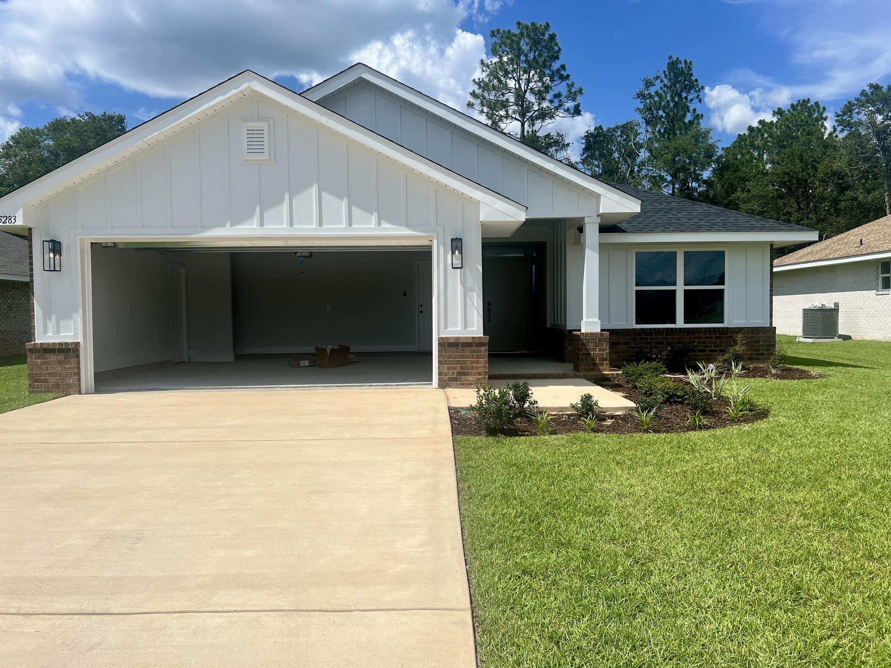 5283 Hidden Pines Circle Milton, FL 32583 - Photo 15 of 16 a front view of house with yard