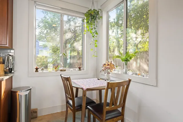 a view of a dining room with furniture window and outside view