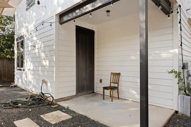 a view of a door and chair and door in the patio