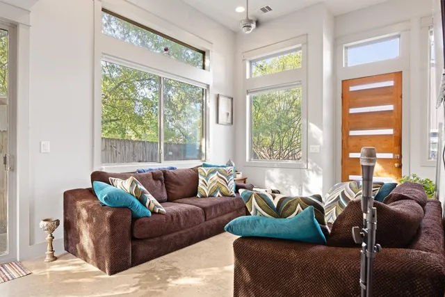 a living room with furniture and a large window